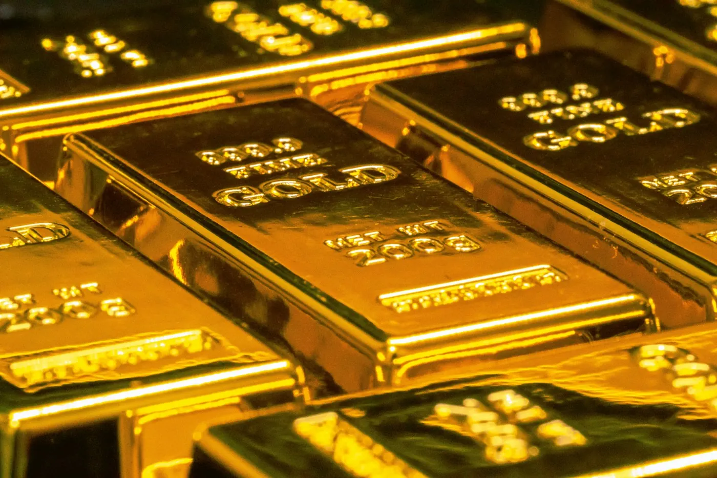 Close-up of stacked fine gold bullion bars
